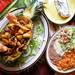The Cancun Mexican Grill include pineapple fajitas are grilled chicken, steak, and shrimp missed with chorizo, bell peppers, onions and pineapple topped with asadero cheese and served in a halved pineapple. Fajitas, beans, rice, pico and sour cream on the side.  Melanie Maxwell | AnnArbor.com